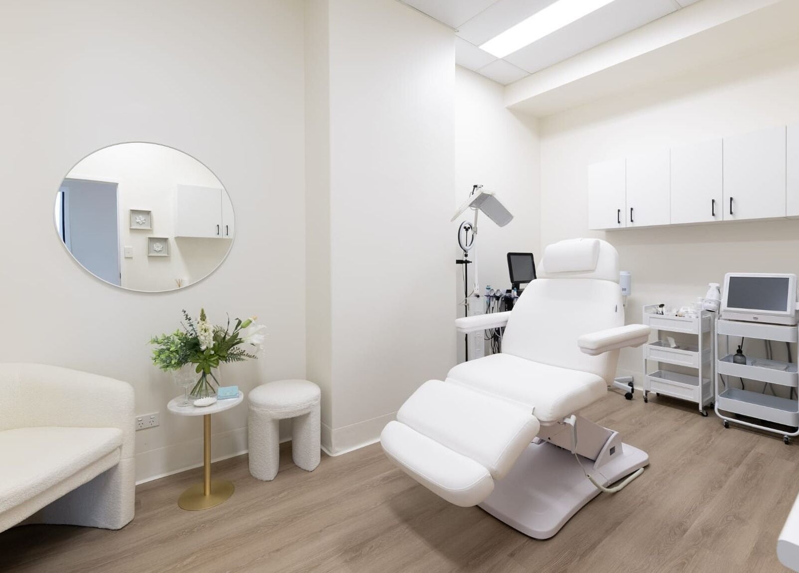 Luxurious treatment room at Lumina Skincare Clinic, Gold Coast, Queensland, AU. Elegant white decor.