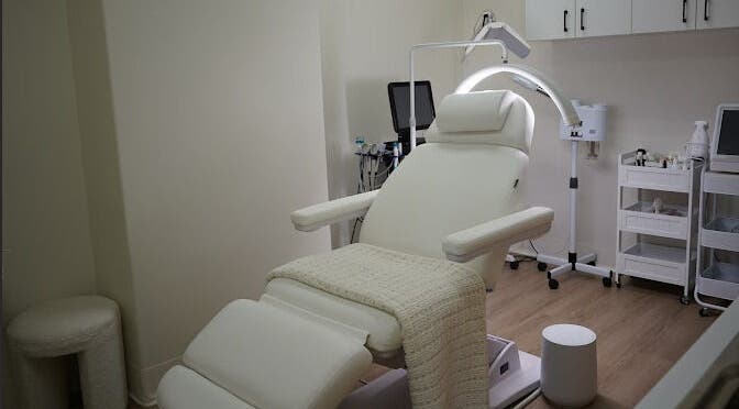 Luxurious treatment room at Lumina Skincare Clinic, Gold Coast, Queensland, AU, featuring a modern recliner.