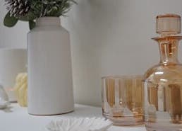 Chic decor at Lumina Skincare Clinic, Gold Coast, Queensland, AU. Elegant glassware and vase arrangement.