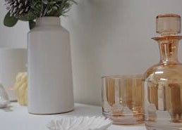 Chic decor at Lumina Skincare Clinic, Gold Coast, Queensland, AU. Elegant glassware and vase arrangement.