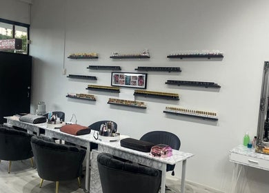 Interior of Reshu’s Beauty & Nails NEW LYNN salon in Auckland, NZ, showcasing elegant nail stations and decor.