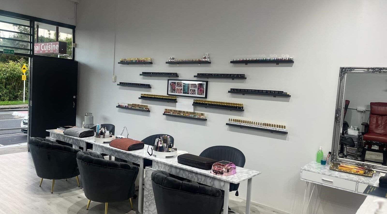 Interior of Reshu’s Beauty & Nails NEW LYNN salon in Auckland, NZ, showcasing elegant nail stations and decor.