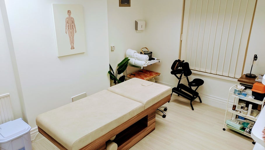 Serene therapy room at Holistic Therapies by Camille, Cardiff, Wales, GB. Features massage table and calming decor.