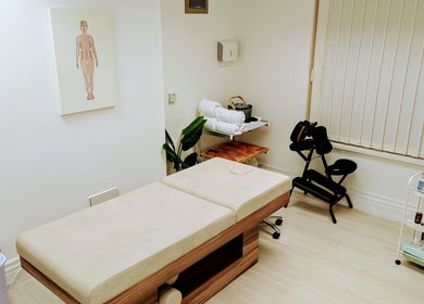 Serene therapy room at Holistic Therapies by Camille, Cardiff, Wales, GB. Features massage table and calming decor.