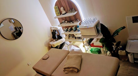 Relaxing therapy room at Holistic Therapies by Camille, Cardiff, Wales, GB. Calm ambiance with massage table.