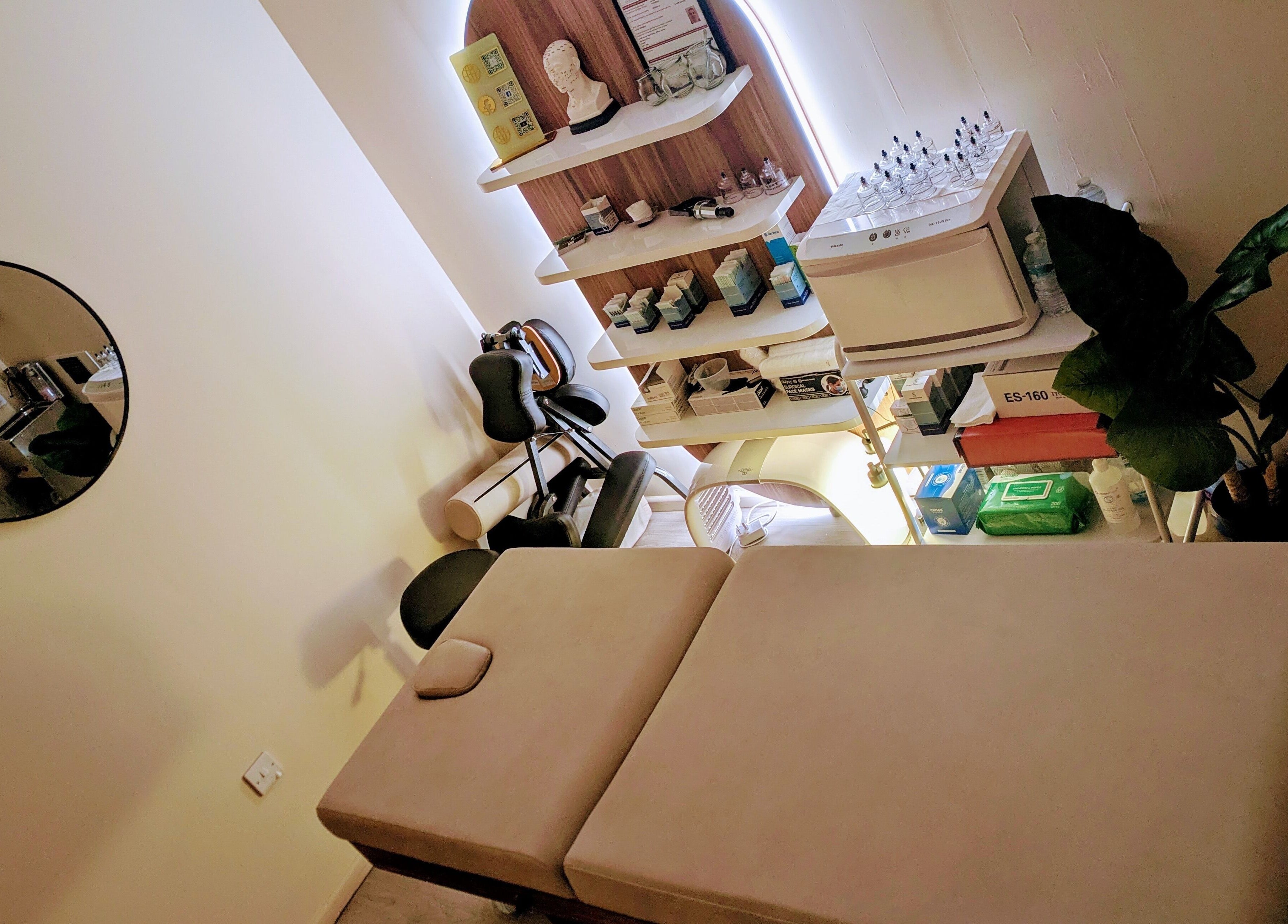Relaxing therapy room setup at Holistic Therapies by Camille, Cardiff, Wales, GB, featuring a massage table.