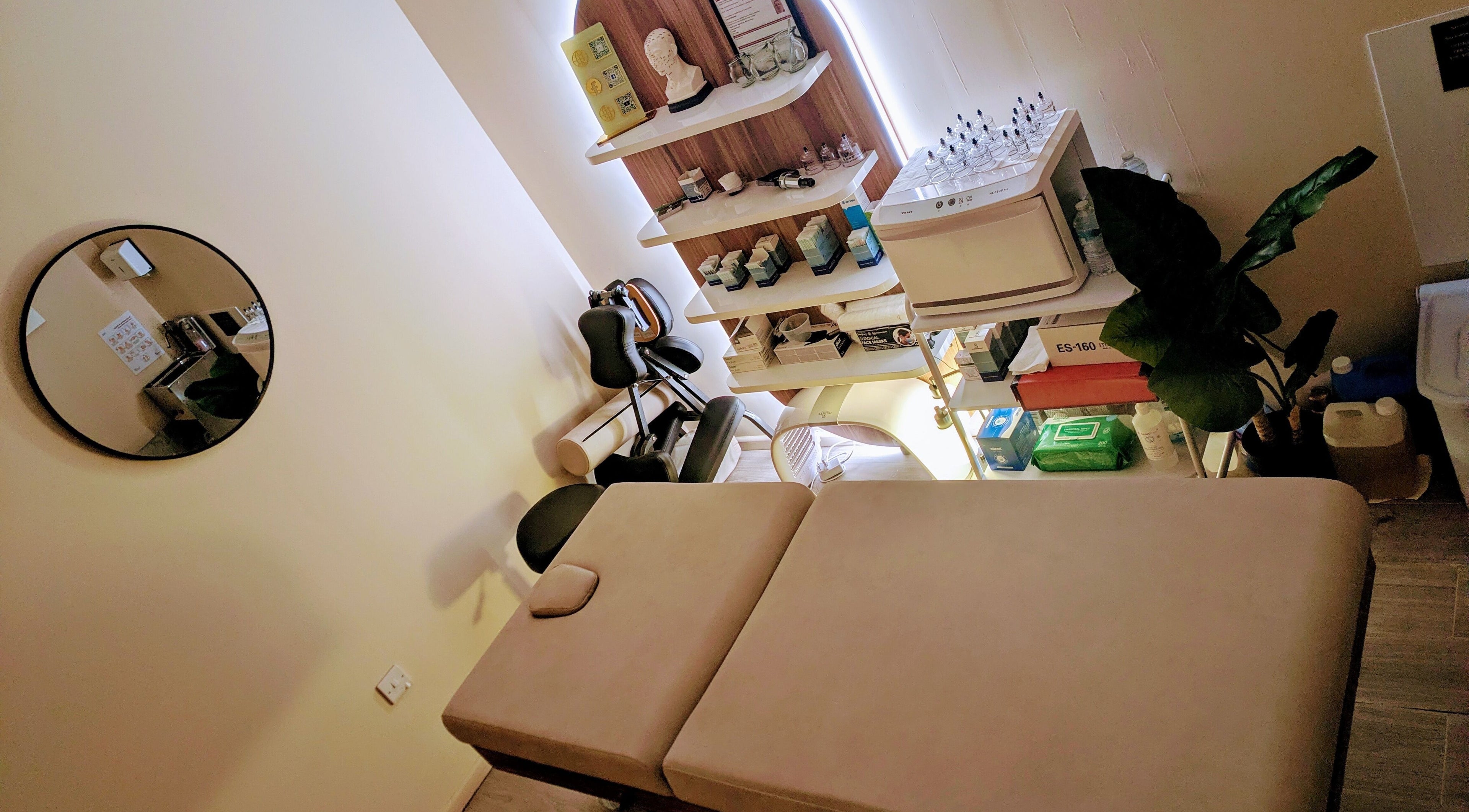 Relaxing therapy room setup at Holistic Therapies by Camille, Cardiff, Wales, GB, featuring a massage table.
