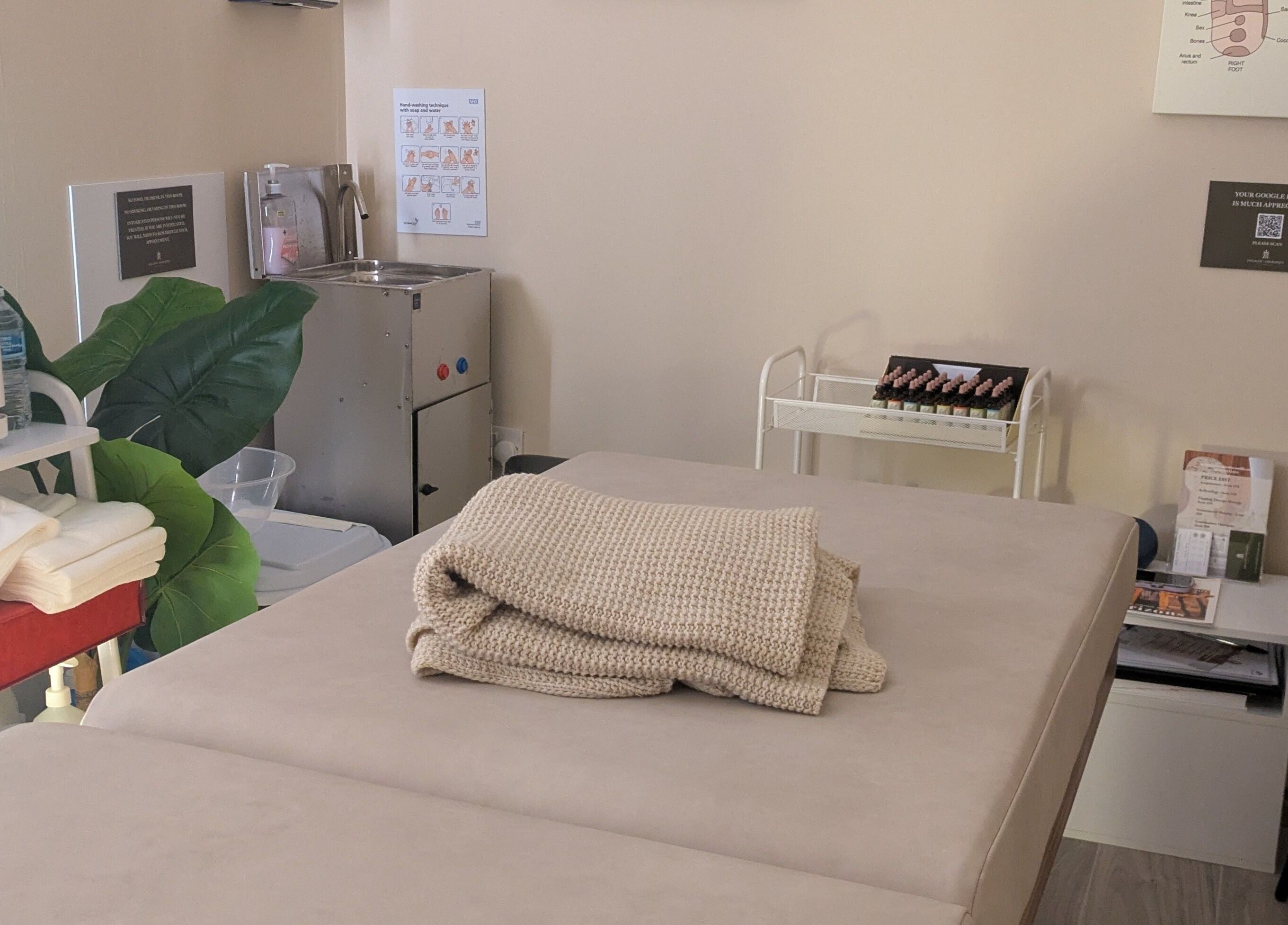 Therapy room at Holistic Therapies by Camille, Cardiff, Wales, GB with treatment bed and cozy ambiance.