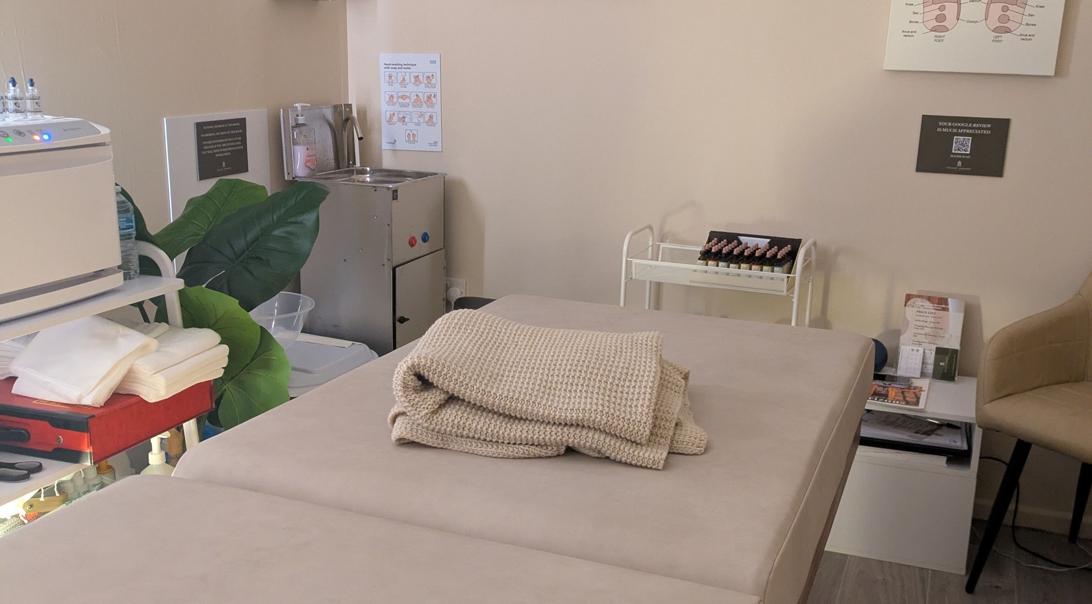 Therapy room at Holistic Therapies by Camille, Cardiff, Wales, GB with treatment bed and cozy ambiance.