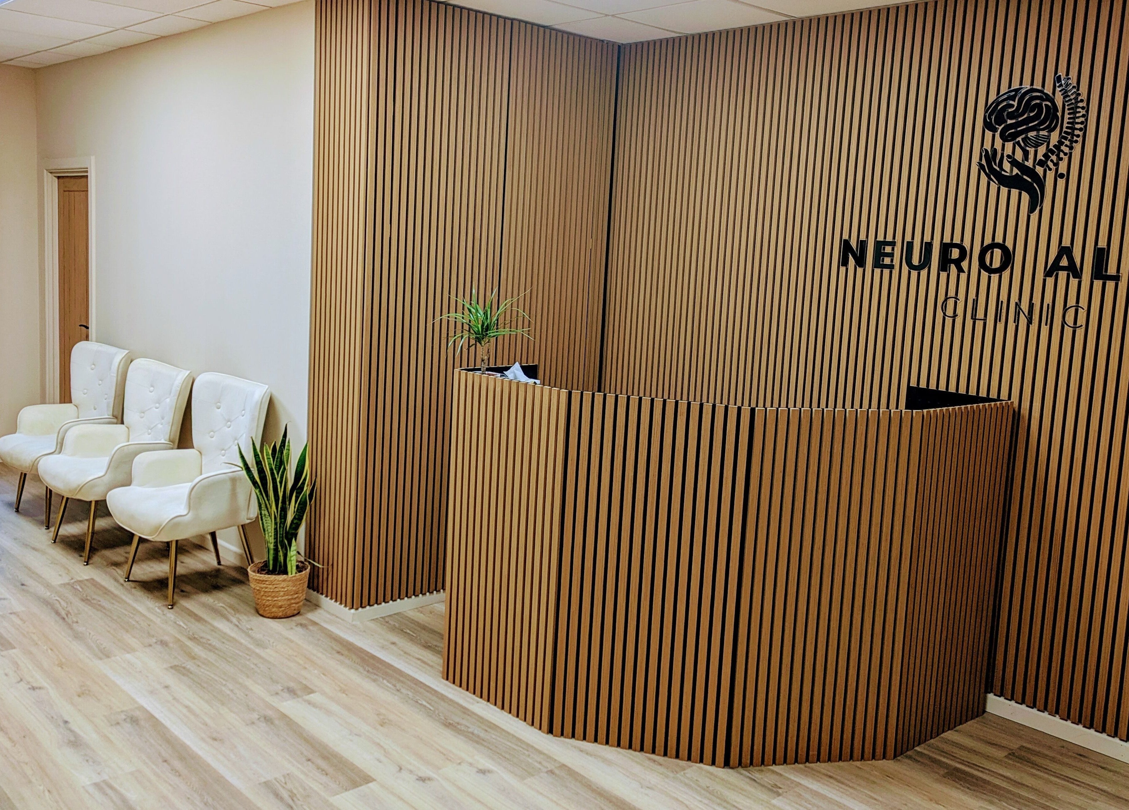 Warm, inviting reception area at Holistic Therapies by Camille, Cardiff, Wales, GB, with wooden decor.