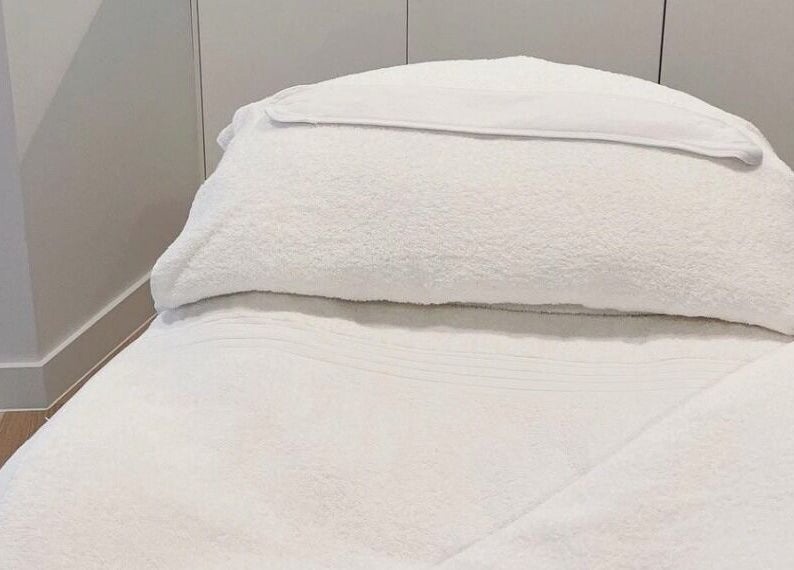 Luxurious spa bed at The Dermal Suite in Lower Plenty, Victoria, AU, offering ultimate relaxation.