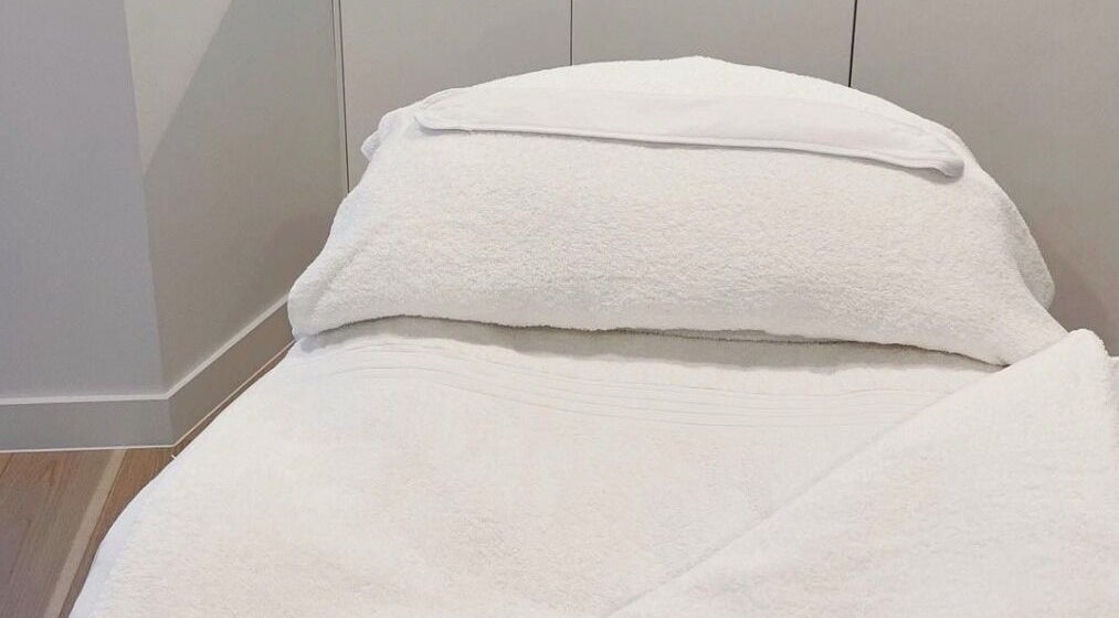 Luxurious spa bed at The Dermal Suite in Lower Plenty, Victoria, AU, offering ultimate relaxation.