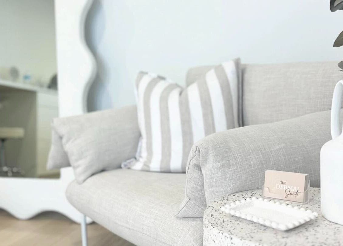 Cozy corner at The Dermal Suite, Lower Plenty, Victoria, AU featuring a plush sofa and decor.