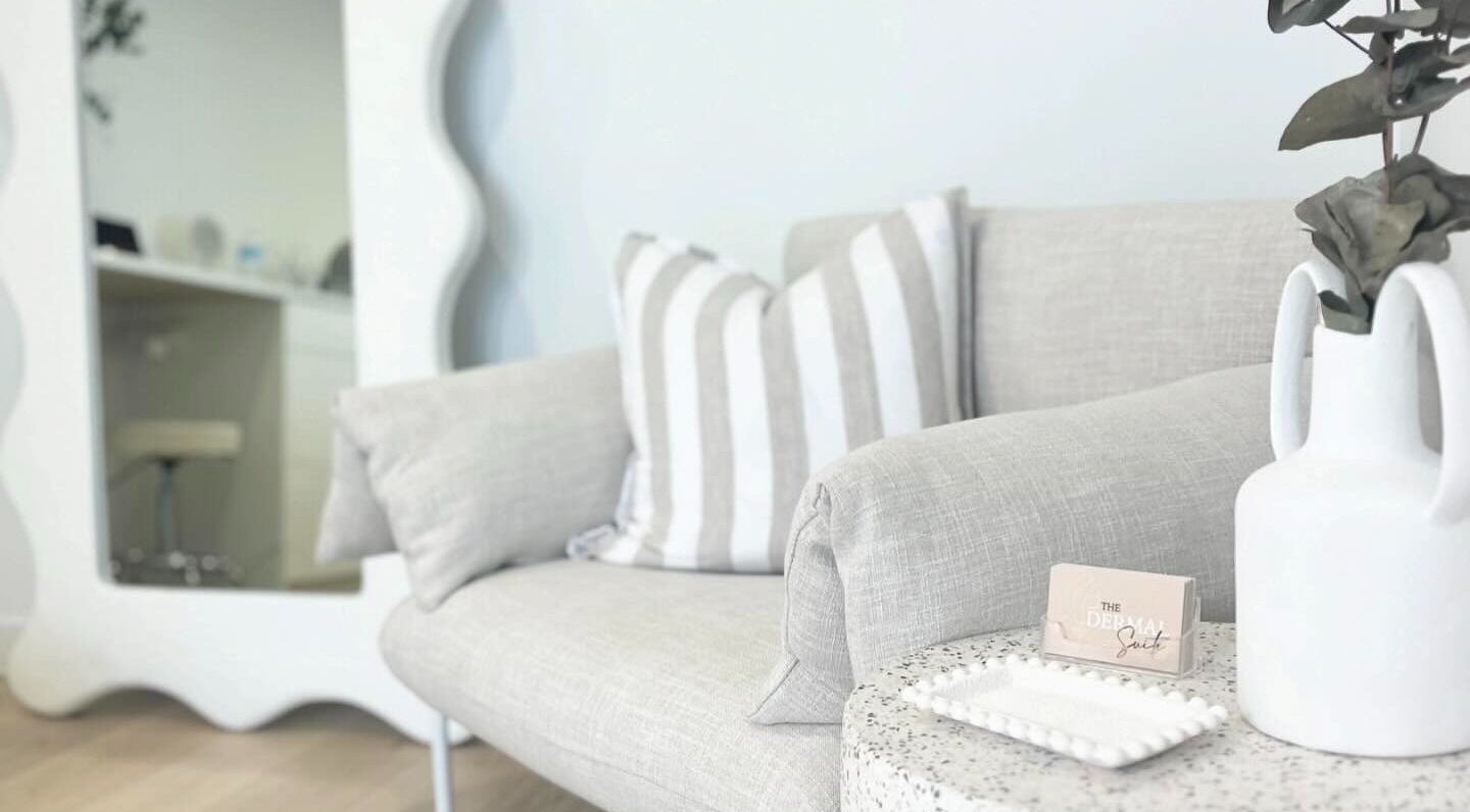 Cozy corner at The Dermal Suite, Lower Plenty, Victoria, AU featuring a plush sofa and decor.