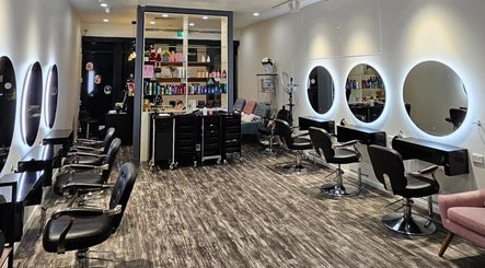 Interior of Clipz Hair Design in Morningside, QLD, AU with stylish chairs and mirrors.