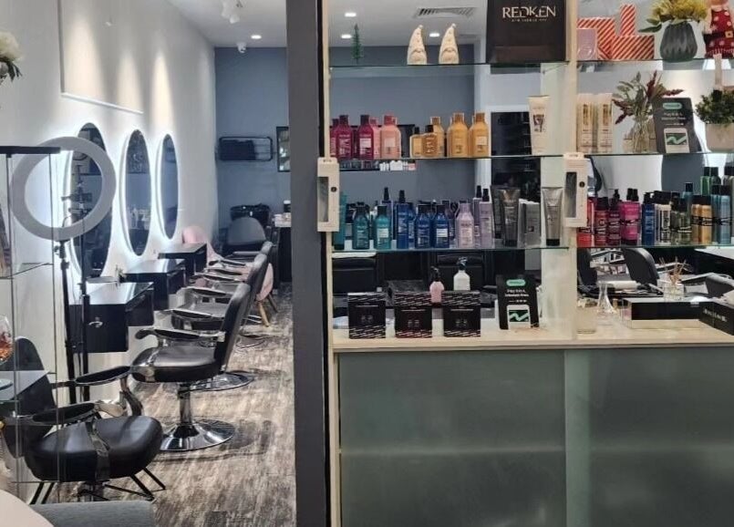 Modern interior of Clipz Hair Design in Morningside, QLD, AU with stylish chairs and premium hair products.