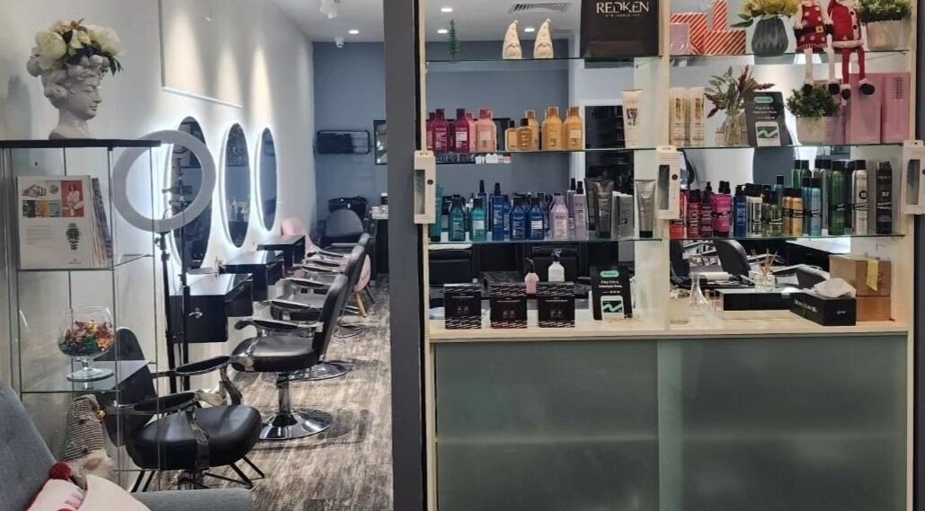Modern interior of Clipz Hair Design in Morningside, QLD, AU with stylish chairs and premium hair products.