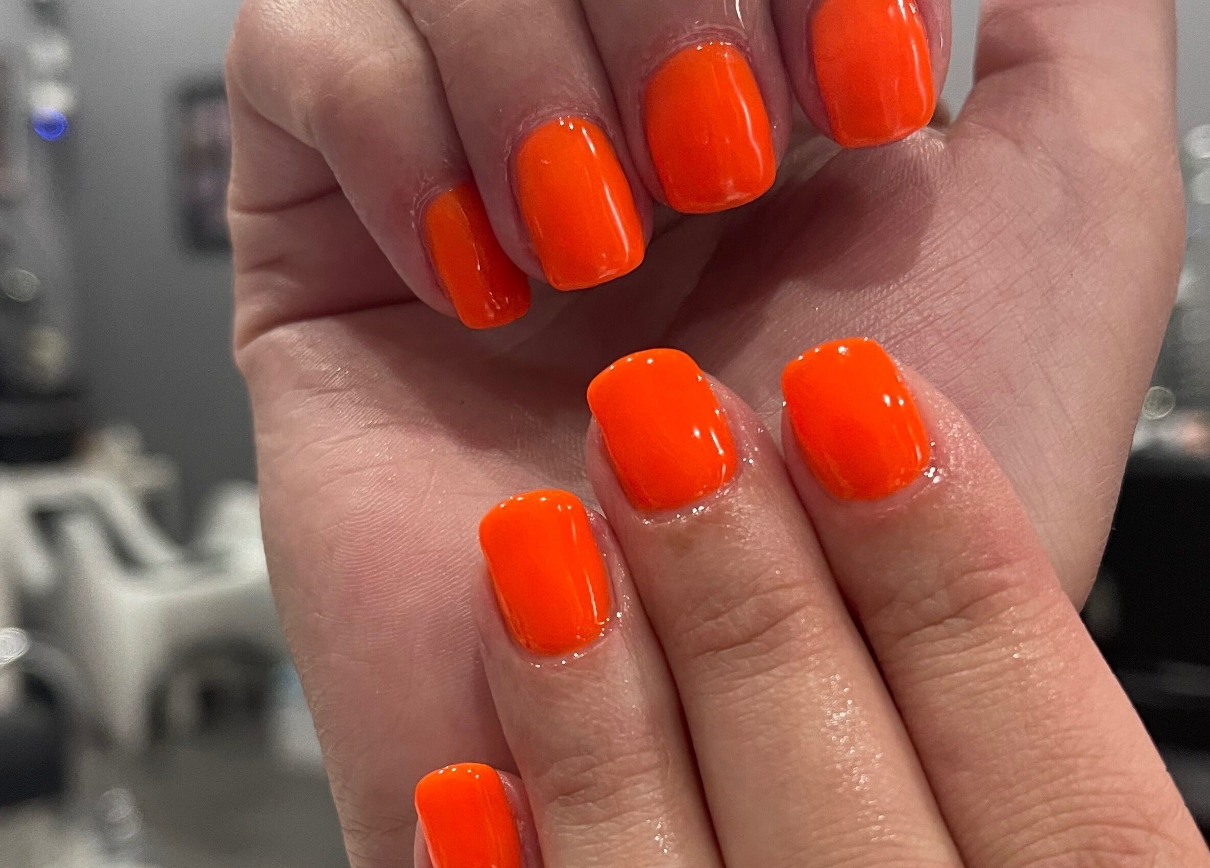 Bright orange nail polish at Ongles Chano, Montréal, Québec, CA. Perfect for a bold, vibrant look.