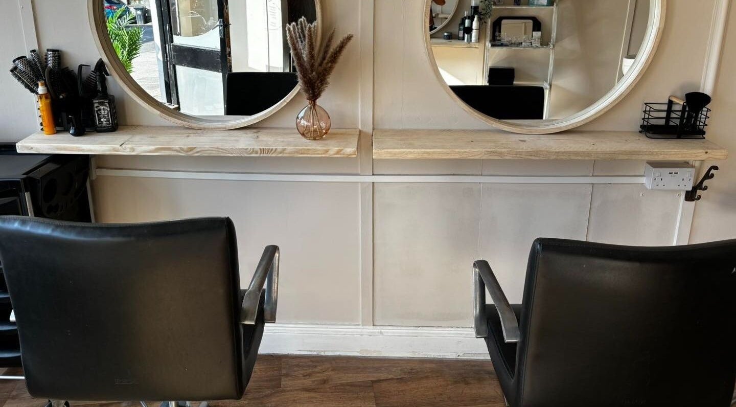 Modern salon chairs and mirrors at Bodyworx Studios, St Austell, England, GB. Comfortable and stylish venue.