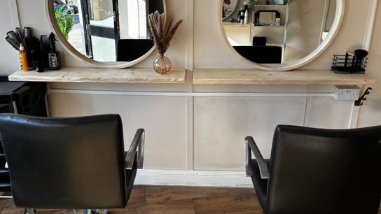 Modern salon chairs and mirrors at Bodyworx Studios, St Austell, England, GB. Comfortable and stylish venue.