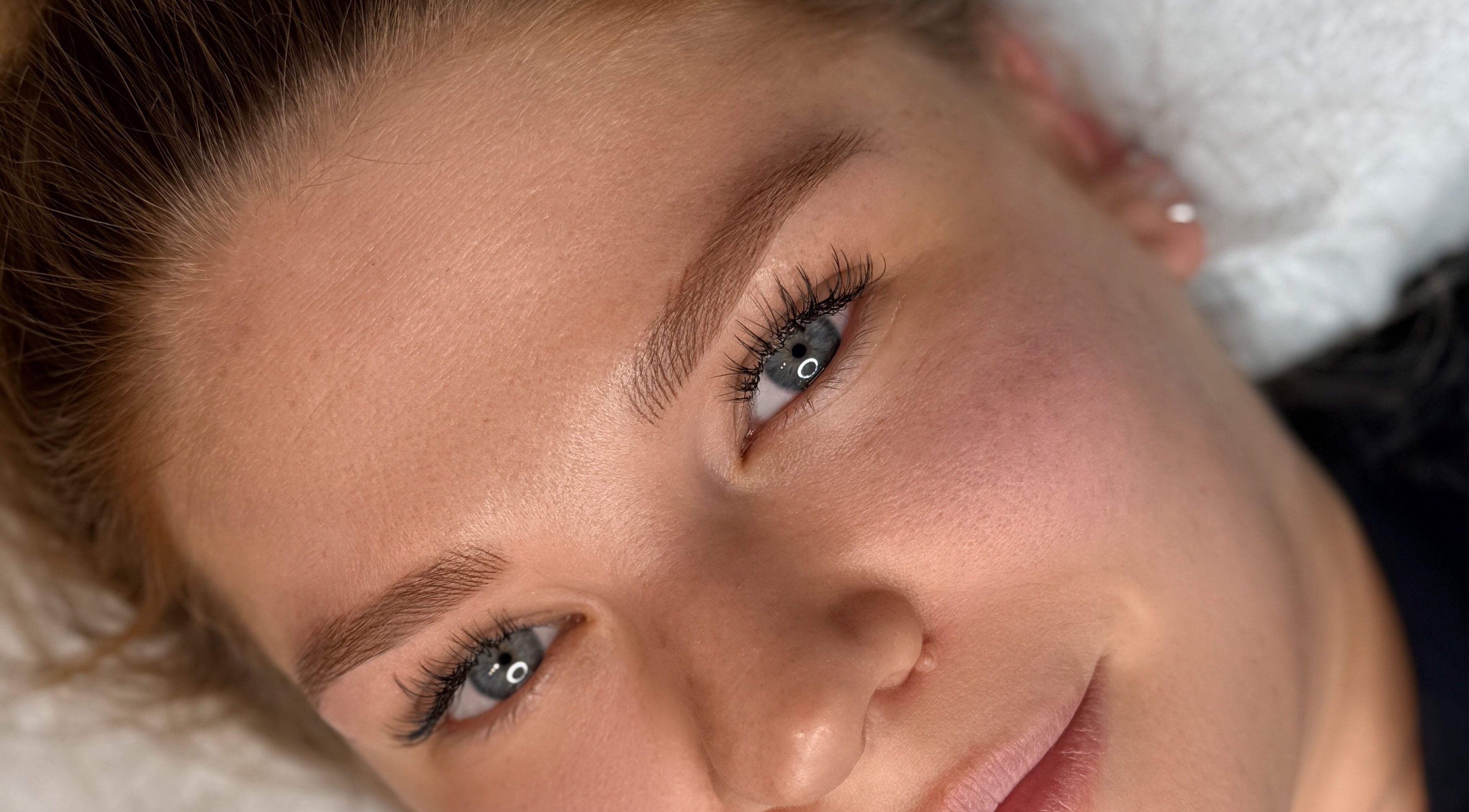 Close-up of perfectly shaped eyebrows at Suburban Glow, Wilmslow, England, GB.