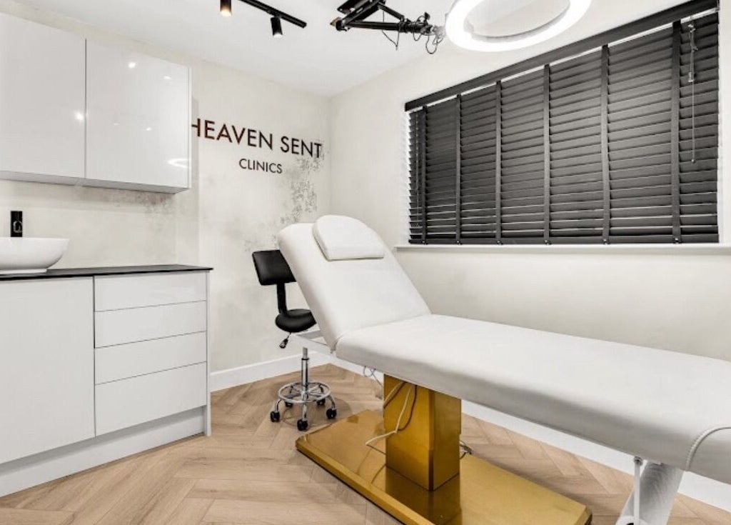 Well-designed treatment room at Suburban Glow, Wilmslow, England, GB, featuring modern decor and a comfortable bed.