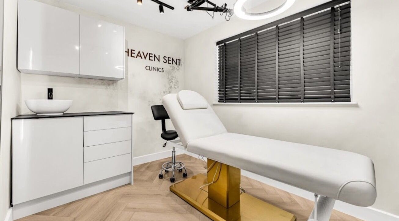 Well-designed treatment room at Suburban Glow, Wilmslow, England, GB, featuring modern decor and a comfortable bed.