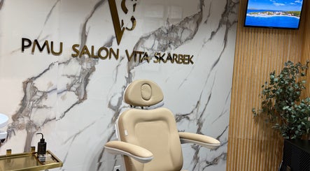 Luxurious seating at PMU Salon VS, Dallas, Texas, US showcases a chic, modern aesthetic.