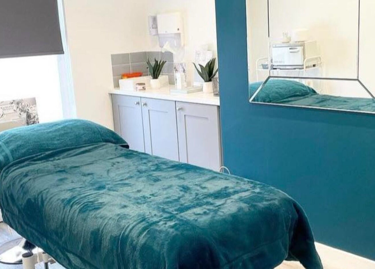 Polished House Of Beauty's serene treatment room with teal décor in Bury, England, GB.