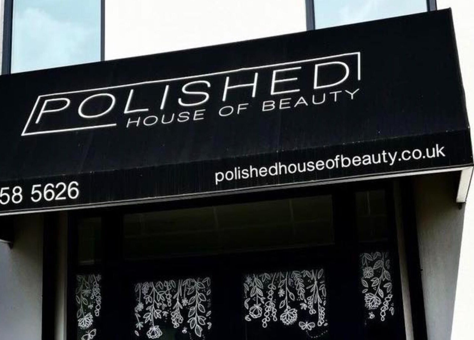 Entrance awning of Polished House Of Beauty, Bury, England, GB displaying contact details and website.