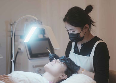 Facial treatment at FIT Beauty Brisbane, Brisbane City, Queensland, AU, professional therapist in focus.