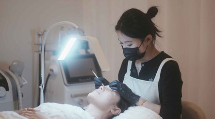 Facial treatment at FIT Beauty Brisbane, Brisbane City, Queensland, AU, professional therapist in focus.