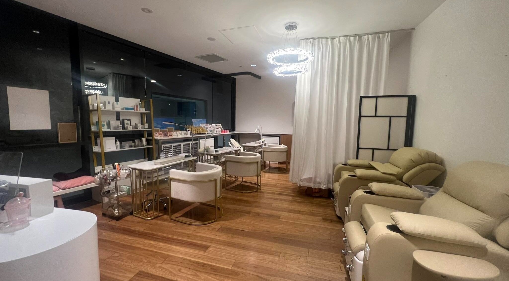 Luxurious nail salon at FIT Beauty Brisbane in Brisbane City, Queensland, AU with plush seating and modern decor.