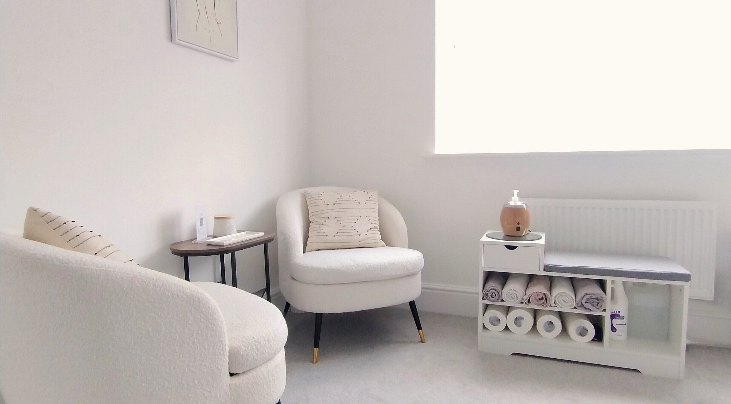 Cozy seating area at Meadow Vale Beauty in Cottingham, England, GB, showcasing minimalist design and soft textures.