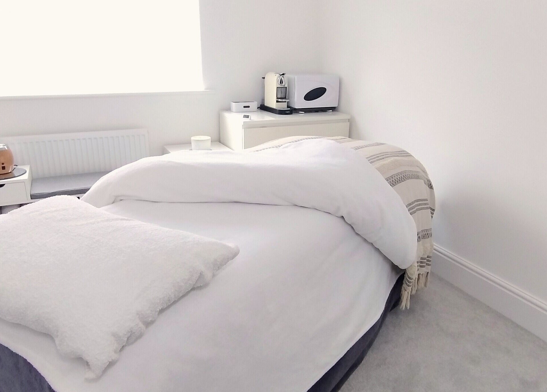 Relaxing massage room at Meadow Vale Beauty, Cottingham, England, GB with cozy bed and ambient decor.