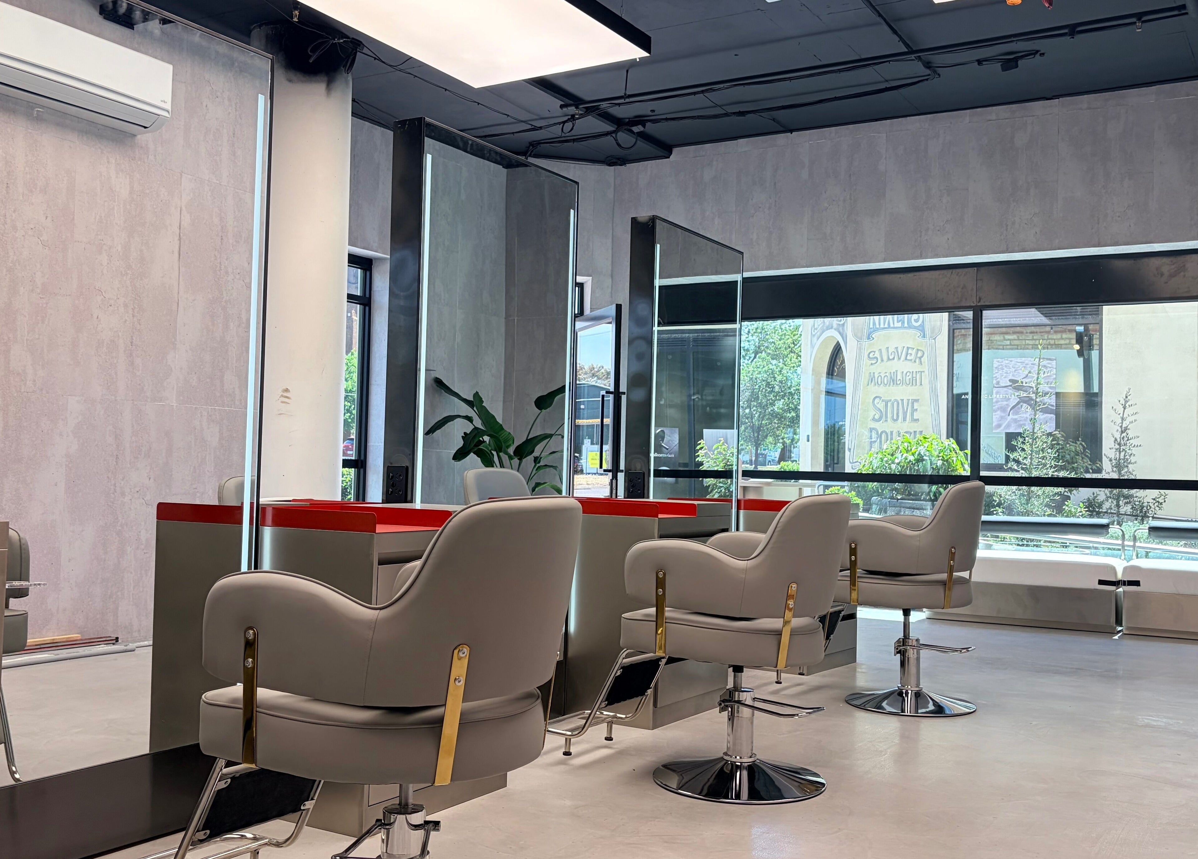 Bright, modern salon interior at Bspoke Barbershop Malvern, Melbourne, Victoria, AU with sleek styling chairs.