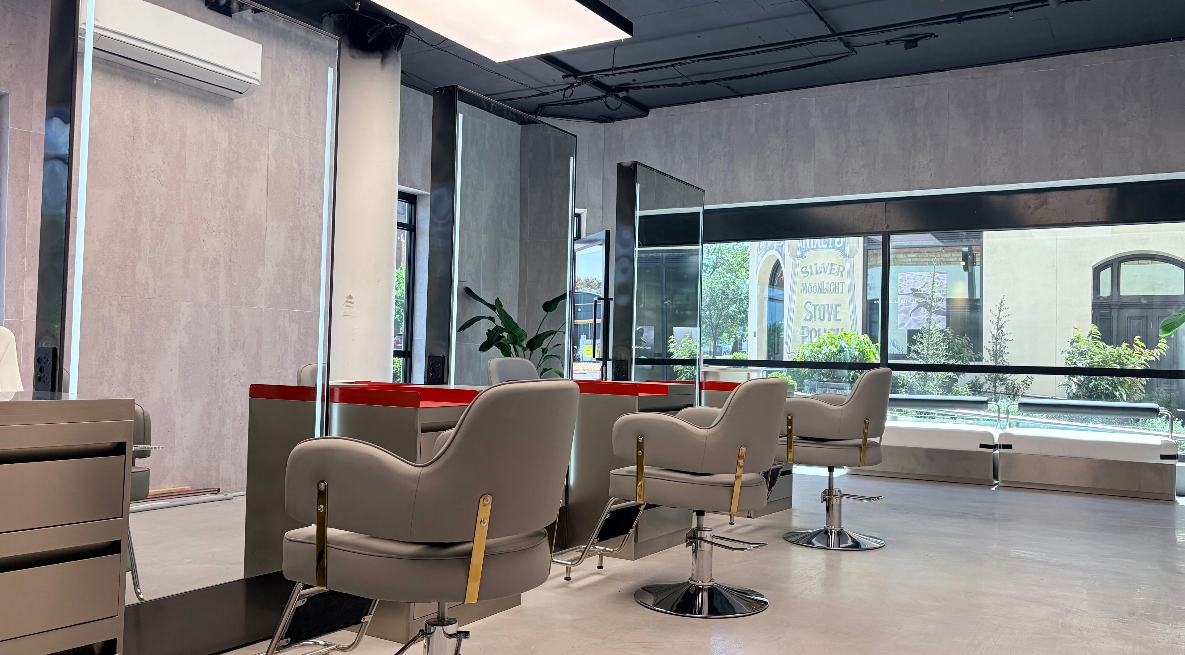 Bright, modern salon interior at Bspoke Barbershop Malvern, Melbourne, Victoria, AU with sleek styling chairs.