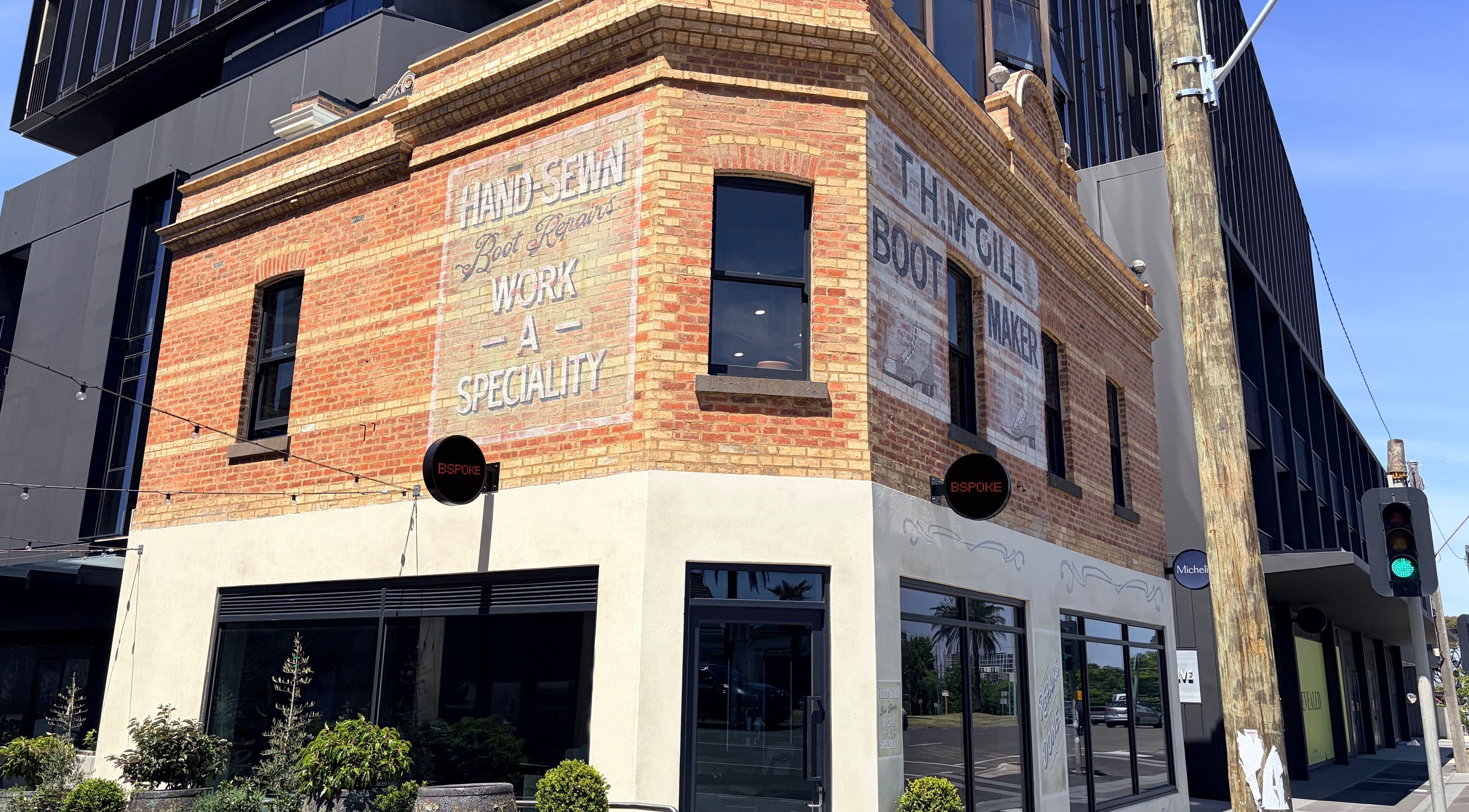 Historic brick facade of Bspoke Barbershop Malvern, Melbourne, Victoria, AU, showcasing vintage charm.