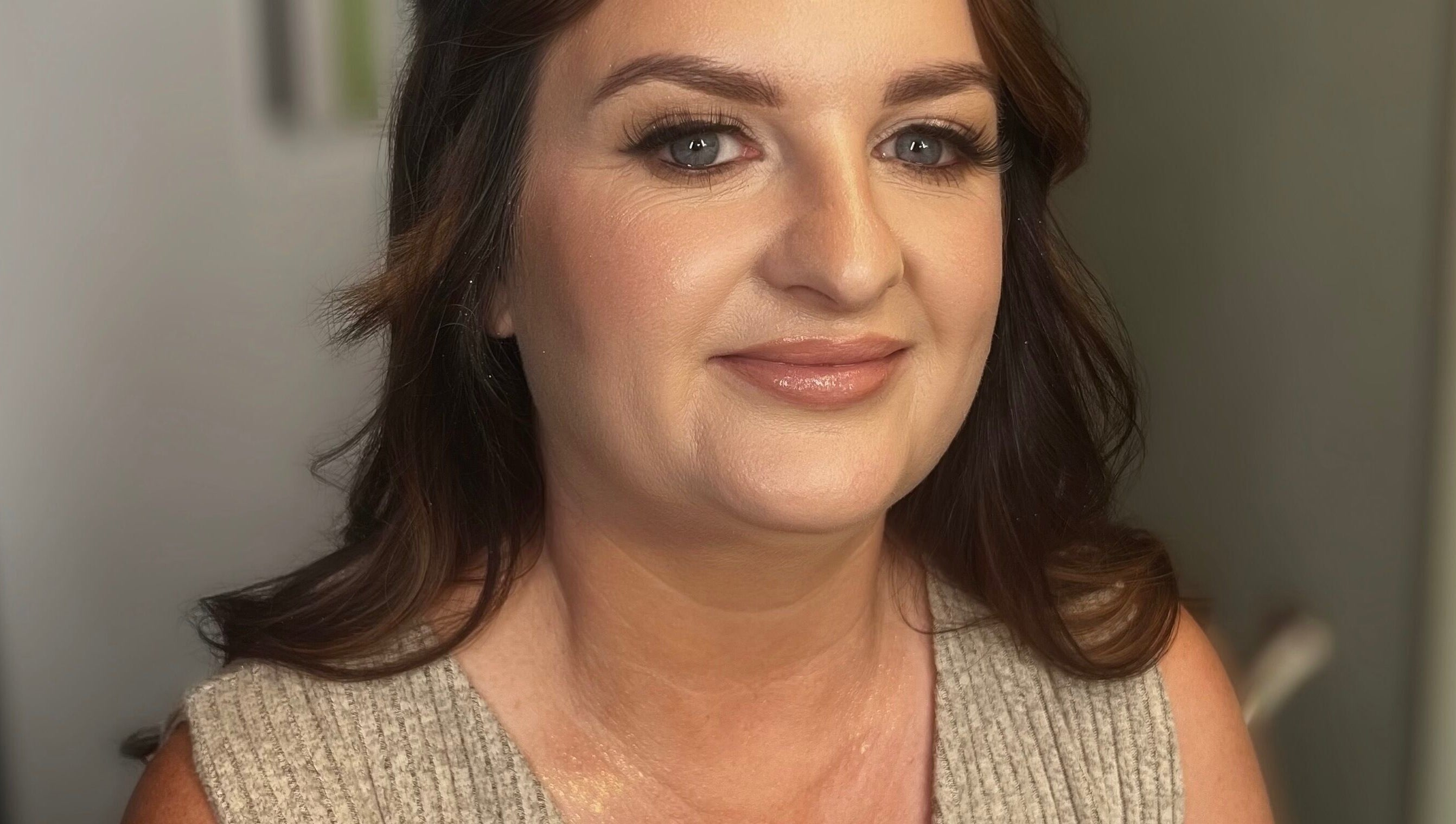Woman with radiant makeup at Faces by Fahey, Ossett, England, GB, showcasing flawless skin and beauty.