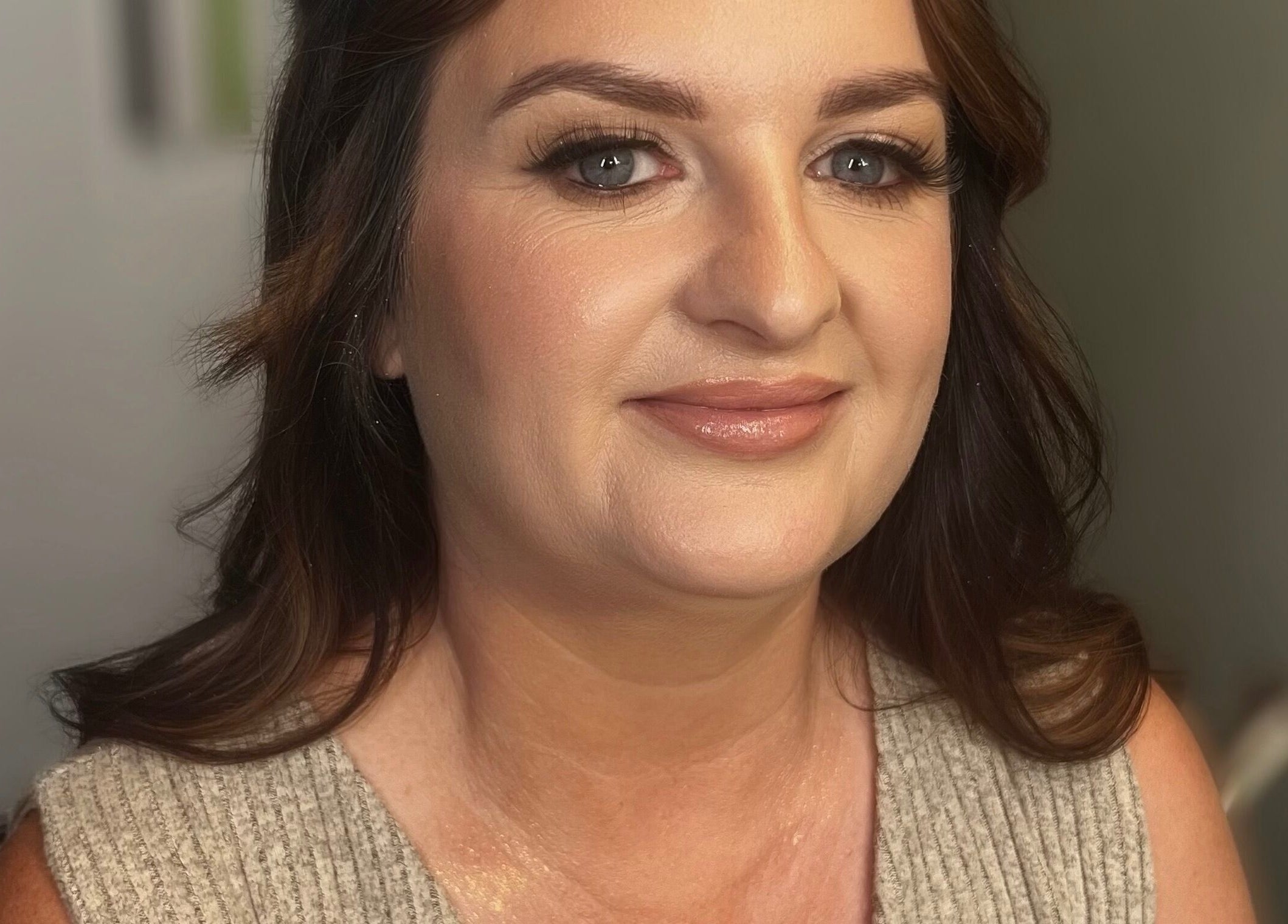 Woman with radiant makeup at Faces by Fahey, Ossett, England, GB, showcasing flawless skin and beauty.