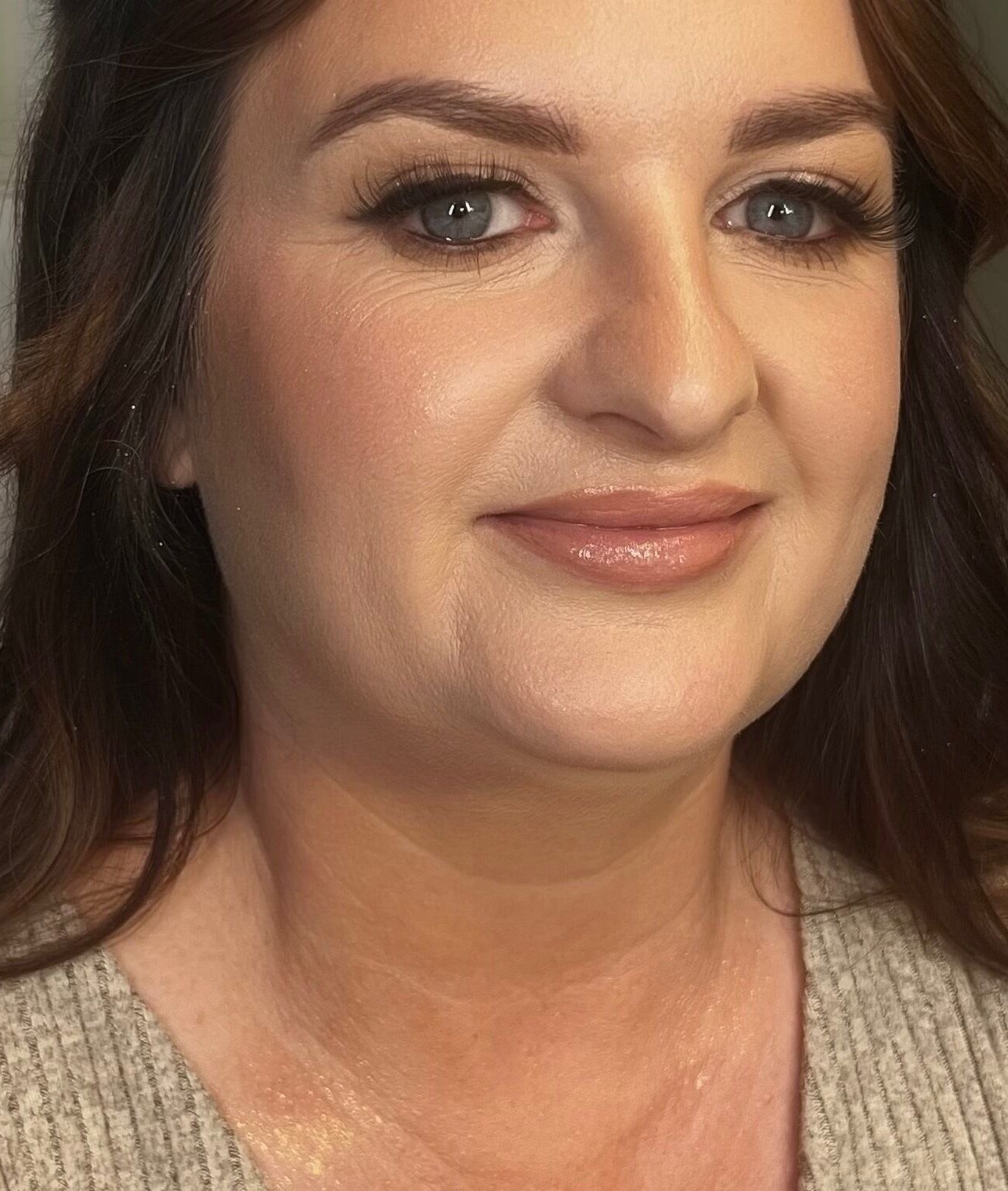 Woman with radiant makeup at Faces by Fahey, Ossett, England, GB, showcasing flawless skin and beauty.