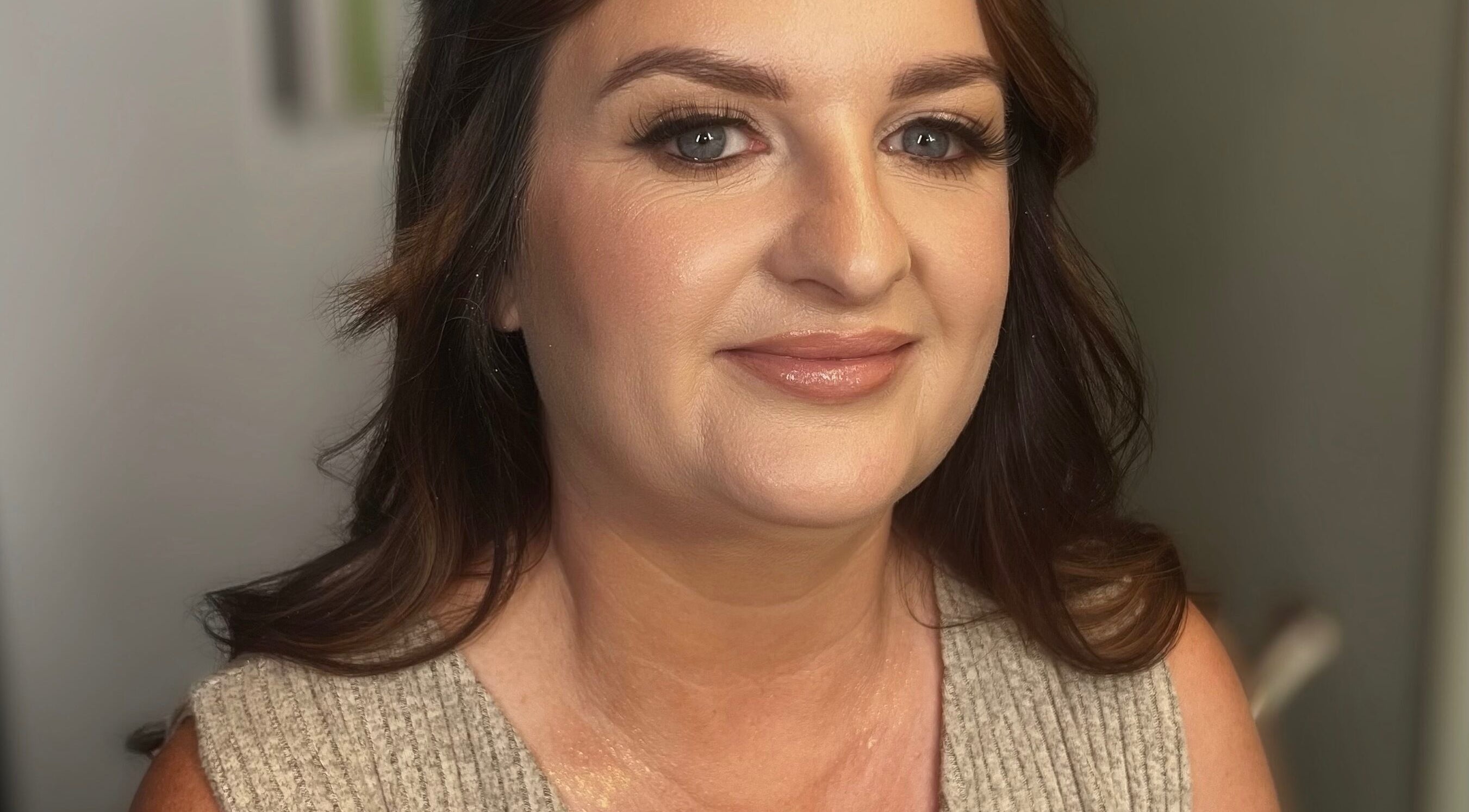 Woman with radiant makeup at Faces by Fahey, Ossett, England, GB, showcasing flawless skin and beauty.
