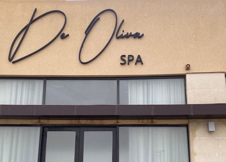 Front view of De Oliva Spa with stylish signage in Riyadh, SA.
