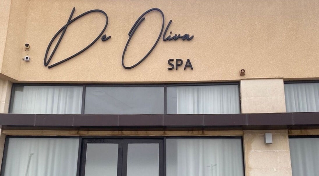 Front view of De Oliva Spa with stylish signage in Riyadh, SA.