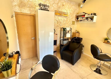 Elegant styling chairs and decor at Modo Hair Salon, Peguera, Illes Balears, ES.