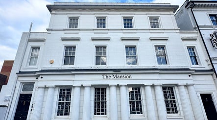 Front view of The Mansion Spa, an elegant white building in Birmingham, England, GB.