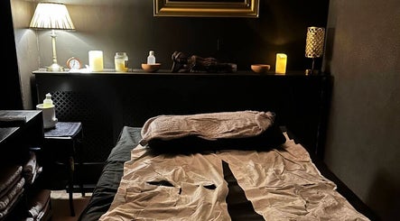 Cozy massage room at The Mansion Spa, Birmingham, England, GB, offering a serene and peaceful ambiance.