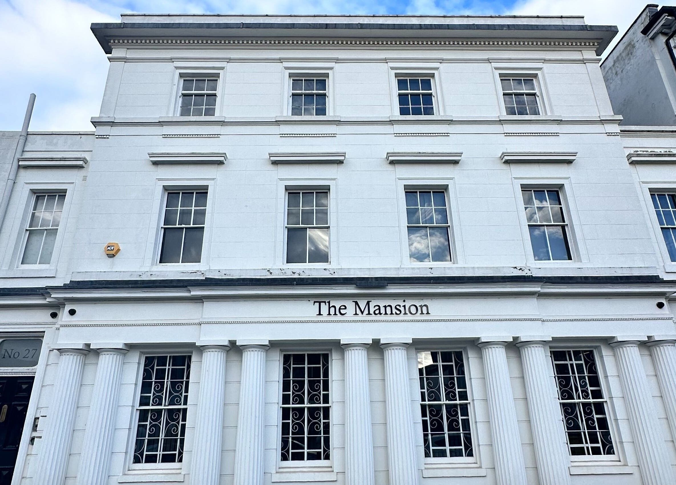 Front view of The Mansion Spa, a white classical building in Birmingham, England, GB.