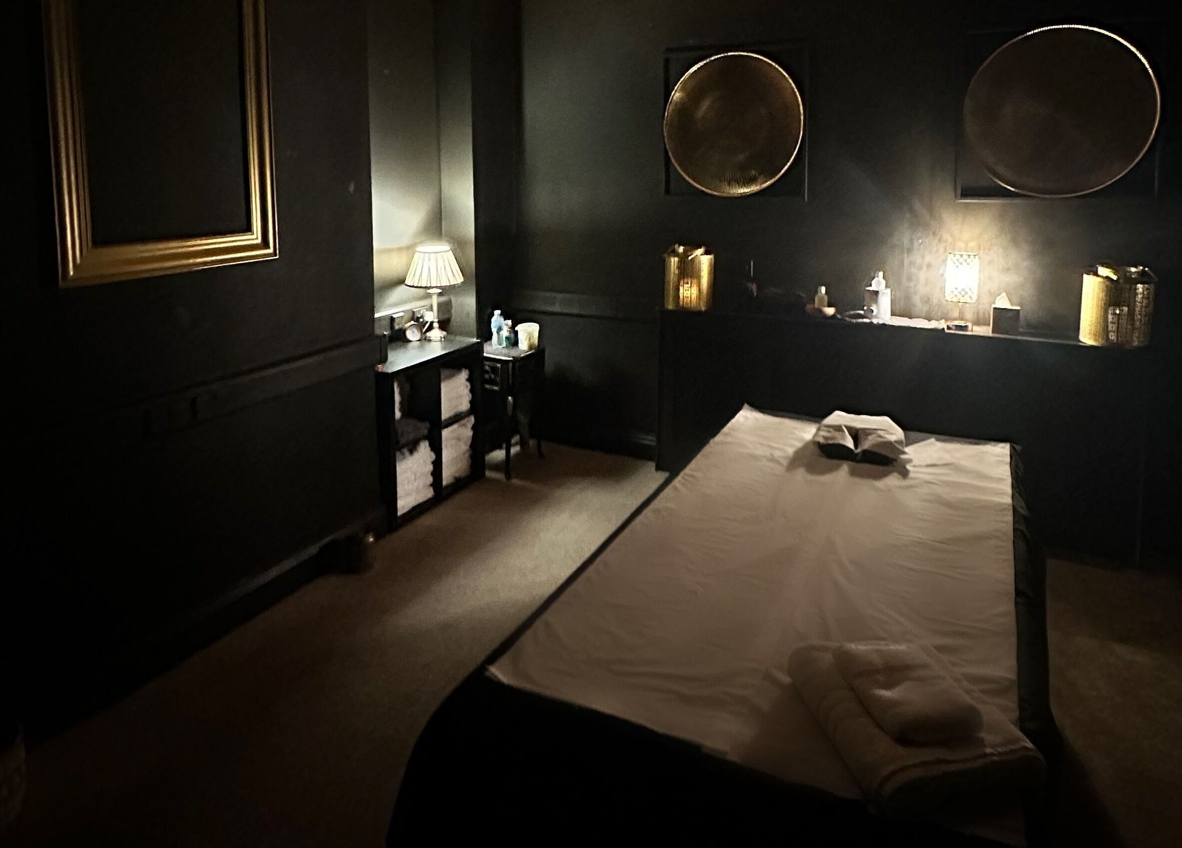 Relaxing massage room at The Mansion Spa, Birmingham, England, GB. Calming atmosphere with soft lighting.