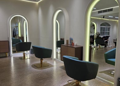 Modern salon interior with chic mirrors and chairs at By H Beauty Ladies Salon, Dubai, Dubai, AE.